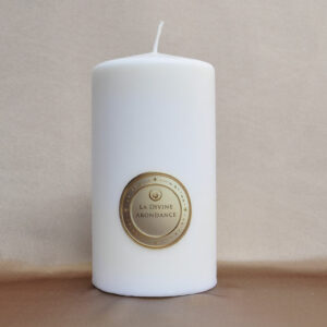 Divine Abundance Candle shining with a golden and generous light
