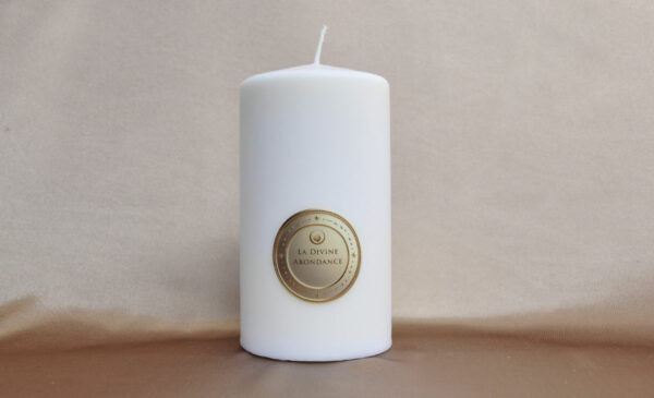 Divine Abundance Candle shining with a golden and generous light