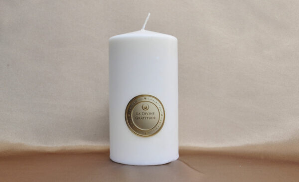 Divine Gratitude Candle radiating a warm and comforting light
