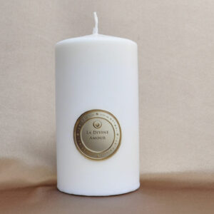 Divine Love Candle glowing with a soft and warm light
