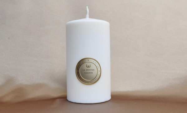 Divine Love Candle glowing with a soft and warm light